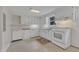 Bright, efficient kitchen features white cabinetry and ample counter space at 913 Ranch Farm Rd, Raleigh, NC 27603