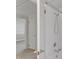 White shower, light fixtures, and brass hardware enhance this bathroom design at 913 Ranch Farm Rd, Raleigh, NC 27603