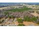 An aerial view shows a well-kept home surrounded by lush trees and scenic views at 918 Circle Dr, Angier, NC 27501