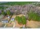 A charming home nestled among the trees with an inviting yard and driveway at 918 Circle Dr, Angier, NC 27501