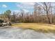 Large backyard area with a mix of gravel and grass, offering versatile usage at 918 Circle Dr, Angier, NC 27501
