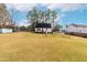 Expansive backyard featuring a large grassy area, perfect for outdoor activities and relaxation at 918 Circle Dr, Angier, NC 27501