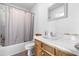 Clean bathroom with a single sink vanity and a shower-tub combination at 918 Circle Dr, Angier, NC 27501
