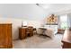 Cozy bedroom featuring plush bedding and a comfortable workspace at 918 Circle Dr, Angier, NC 27501