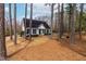 Cozy single-story home features a welcoming entrance, neat landscaping, and beautiful natural surroundings at 918 Circle Dr, Angier, NC 27501