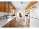 Efficient kitchen with white countertops, white appliances, and wood cabinets at 918 Circle Dr, Angier, NC 27501