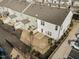 Aerial view of backyard including small lawn, small patio, and fence at 1003 Mirbeck Ln, Durham, NC 27713