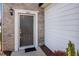 Close-up of a townhome's front door with decorative trim and visible house number at 1003 Mirbeck Ln, Durham, NC 27713