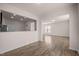 Open-concept living area showcasing wood floors and an open view into another room at 1003 Mirbeck Ln, Durham, NC 27713