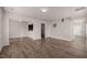 Spacious living room featuring modern wood-look floors, neutral paint, and great natural light at 1003 Mirbeck Ln, Durham, NC 27713