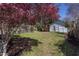 Spacious backyard featuring blooming tree and tool shed. A great space for outdoor activities at 1010 Rosehill Ave, Durham, NC 27705