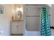 Charming bathroom with vintage-style fixtures, a tub/shower combination, and a mirrored vanity at 1010 Rosehill Ave, Durham, NC 27705