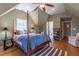 Comfortable bedroom featuring hardwood floors, recessed lighting, and an en suite bathroom at 1010 Rosehill Ave, Durham, NC 27705