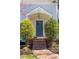 Inviting front entryway with brick steps, mature landscaping, and classic architectural details at 1010 Rosehill Ave, Durham, NC 27705