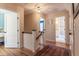 Upstairs hallway with hardwood floors and views into the bedrooms and bathrooms of the home at 1010 Rosehill Ave, Durham, NC 27705