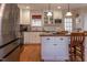 Well-appointed kitchen featuring stainless steel appliances and a functional center island with breakfast bar at 1010 Rosehill Ave, Durham, NC 27705