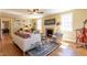 Bright and inviting living room with hardwood floors, fireplace, and stylish decor at 1010 Rosehill Ave, Durham, NC 27705