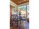 Comfortable covered patio with a table and four chairs. Perfect for outdoor dining at 1010 Rosehill Ave, Durham, NC 27705