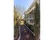 Stone pathway leading to screened porch, enhanced with landscaping and border plants for outdoor enjoyment at 1010 Rosehill Ave, Durham, NC 27705