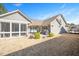 The home features a backyard with a screened porch, patio, and manicured landscaping at 1013 Restoration Dr, Durham, NC 27703