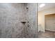 Modern bathroom featuring a tiled shower with a built-in shelf and sleek fixtures at 1013 Restoration Dr, Durham, NC 27703