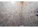 Walk-in shower featuring stylish tile work and a built-in shelf at 1013 Restoration Dr, Durham, NC 27703