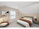 Cozy bedroom with neutral tones, soft carpet, natural light, and stylish furnishings at 1013 Restoration Dr, Durham, NC 27703