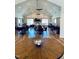 Spacious clubhouse area featuring a fireplace, multiple tables, and comfortable seating at 1013 Restoration Dr, Durham, NC 27703