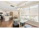 A well-lit dining area adjacent to a spacious kitchen and open-plan living room at 1013 Restoration Dr, Durham, NC 27703