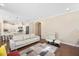 Spacious living area featuring hardwood floors, white furnishings, and an open view of the kitchen at 1013 Restoration Dr, Durham, NC 27703