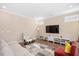 Comfortable living room with hardwood floors, a large screen TV, and cozy seating at 1013 Restoration Dr, Durham, NC 27703