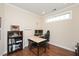 Home office with a bookshelf, desk, and comfortable chair, perfect for remote work at 1013 Restoration Dr, Durham, NC 27703
