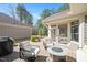 Back patio with seating and a grill at 1013 Restoration Dr, Durham, NC 27703