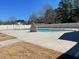 Community pool with sun deck, stairs into the water and a fenced perimeter at 1013 Restoration Dr, Durham, NC 27703