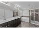 Bathroom features a double sink vanity, large mirror, shower, and soaking tub at 104 Vinewood Pl, Holly Springs, NC 27540
