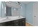 This bathroom has a double sink vanity with a large mirror and cabinet storage at 104 Vinewood Pl, Holly Springs, NC 27540