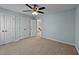 Bedroom featuring double closets, and access to other rooms and bathrooms at 104 Vinewood Pl, Holly Springs, NC 27540