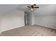 An upstairs bonus room includes a ceiling fan and recessed lighting at 104 Vinewood Pl, Holly Springs, NC 27540