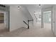 Upstairs hallway featuring neutral paint, carpet and natural light at 104 Vinewood Pl, Holly Springs, NC 27540