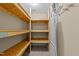 The storage area includes wood shelving and a clothes rack at 104 Vinewood Pl, Holly Springs, NC 27540