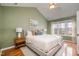 Relaxing bedroom featuring a queen-sized bed and bright windows at 1044 S Philwood Ct, Fuquay Varina, NC 27526