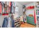Walk-in closet featuring shelving, hanging rods, and ample storage space at 1044 S Philwood Ct, Fuquay Varina, NC 27526