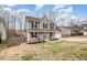 A well-maintained two-story home with a inviting front porch and a lawn at 1044 S Philwood Ct, Fuquay Varina, NC 27526