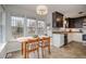 Eat-in kitchen featuring a breakfast nook with large windows and lots of natural light at 1044 S Philwood Ct, Fuquay Varina, NC 27526