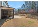 Spacious backyard featuring a covered patio, concrete patio, and fire pit area at 106 Filigree Way, Durham, NC 27713