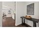 Inviting hallway leading to a living area with abundant natural light and stylish decor at 106 Filigree Way, Durham, NC 27713