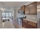 Spacious kitchen with stainless steel appliances, granite counters and an open view of the living area at 106 Florence Pl, Morrisville, NC 27560