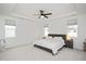 The main bedroom features a tray ceiling, a ceiling fan, and two windows for great natural lighting at 108 Wise Oak Ln, Garner, NC 27529