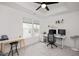 Bright home office with natural light, neutral walls, plush carpet, and contemporary furnishings at 108 Wise Oak Ln, Garner, NC 27529