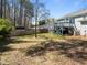 A backyard featuring a deck and a wooden fence at 117 Holly Mountain Rd, Holly Springs, NC 27540